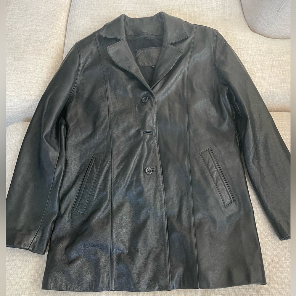 Women’s black leather jacket.